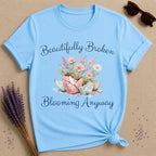 Beautifully Broken Blooming Anyway — Watercolor Resilience T-Shirt for Women in Sky