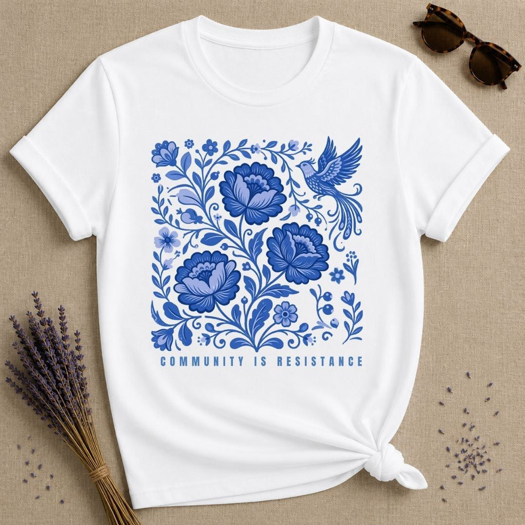 Community Is Resistance — Blue Floral Folk Art T-Shirt for Women in White
