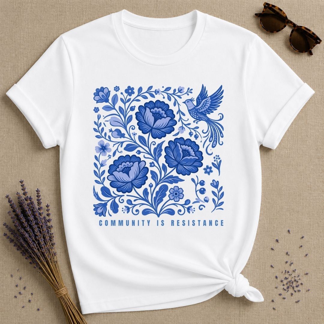 Community Is Resistance — Blue Floral Folk Art T-Shirt for Women in White