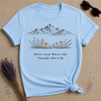 Miles from Where She Thought She’d Be — Mountain Wildflower T-Shirt for Women — Light Blue