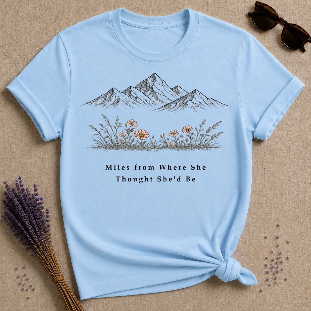 Miles from Where She Thought She’d Be — Mountain Wildflower T-Shirt for Women — Light Blue