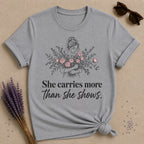 She Carries More Than She Shows — Floral Woman T-Shirt