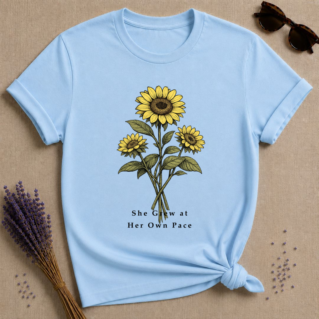 She Grew at Her Own Pace — Sunflower Self Growth T-Shirt for Women — Light Blue