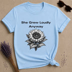 She Grew Loudly Anyway — Sunflower Botanical Graphic Tee for Women in Light Blue
