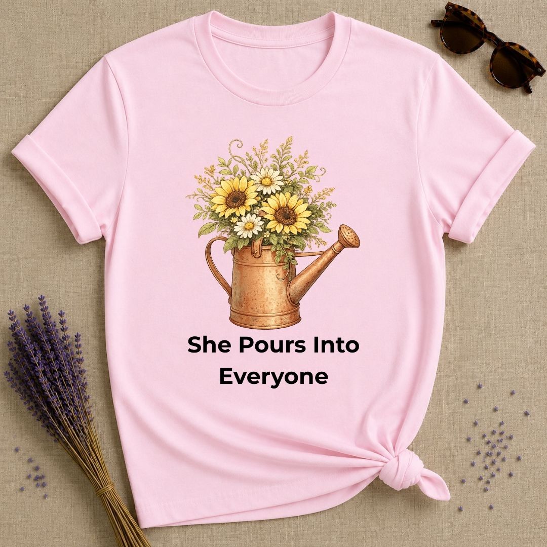 She Pours Into Everyone — Watering Can Floral T-Shirt for Women in Light Pink