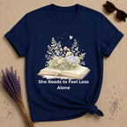 She Reads to Feel Less Alone — Open Book Garden T-Shirt for Women in Navy