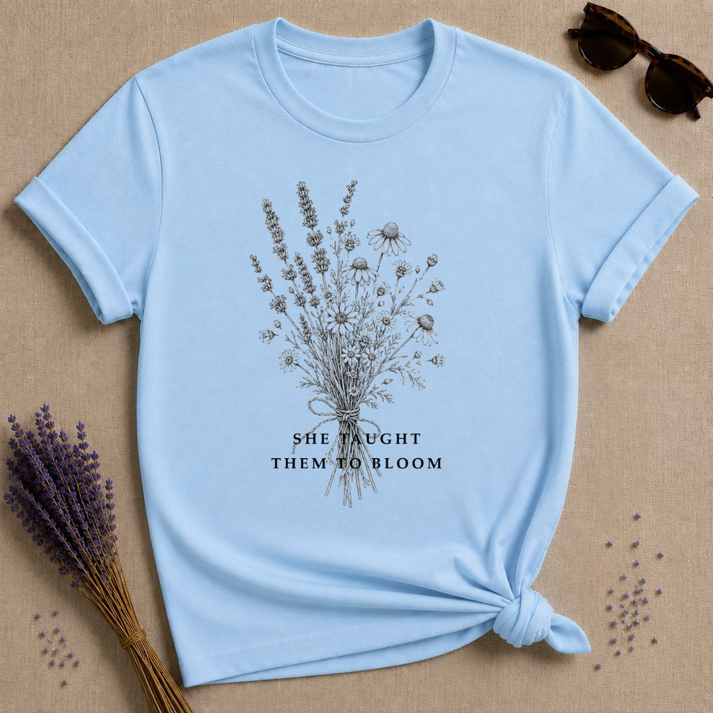 She Taught Them to Bloom — Floral Teacher T-Shirt for Women — Light Blue