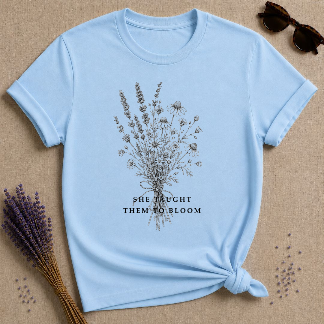 She Taught Them to Bloom — Floral Teacher T-Shirt for Women — Light Blue