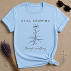 Still Growing Through Everything botanical graphic tee for women